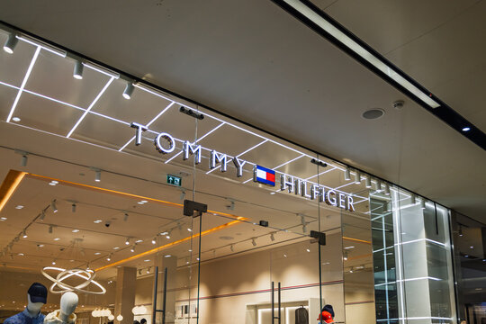 Tommy Hilfiger Storefront with Illuminated Sign. London, UK, 10 February 2024