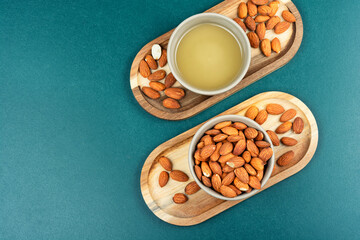 Almond oil with almond seeds.
