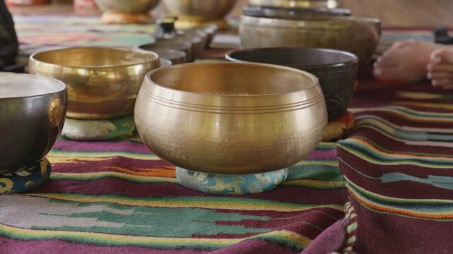Tebet singing bowls stand on the floor before the start of the bowls ceremony in a gazebo on Bali Island
