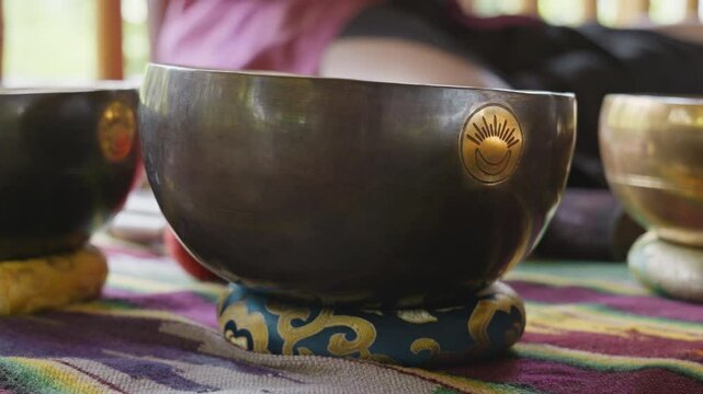 Tebet singing bowls stand on the floor before the start of the bowls ceremony in a gazebo on Bali Island