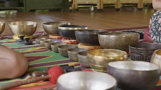 Tebet singing bowls stand on the floor before the start of the bowls ceremony in a gazebo on Bali Island