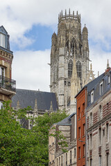 The spire of Saint-Ouen Abbey towering above the surrounding houses