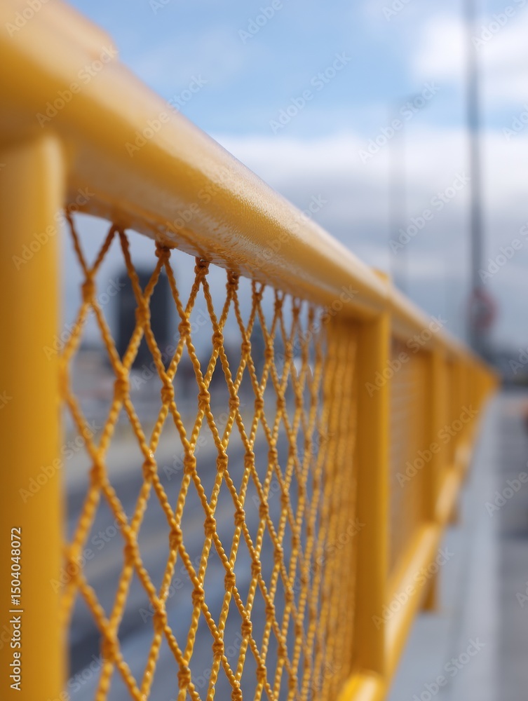 Poster detailed view of safety netting and guardrails with soft upper light captured on a construction site