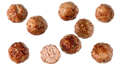Cooked meatballs falling downward isolated on white background