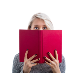 Portrait of a cute young woman hiding behind an open red book, looking scared after reading a spooky story, isolated on transparent background