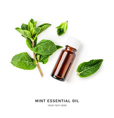 Mint essential oil in bottle, fresh peppermint leaves photography isolated on white background.