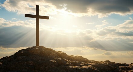 A Silhouette of a Christian Cross on a Rocky Hilltop Against a Dramatic Sky with Sunrays and Clouds