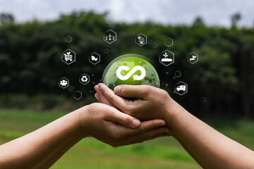 Hands Holding Sustainable Globe with Eco-friendly Icons Surrounding
