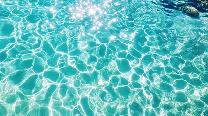 Fototapeta premium Sparkling turquoise water surface texture.