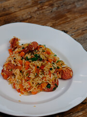 Traditional rustic Brazilian popular food, rice with calabresa sausage and vegetables. Jambalaya