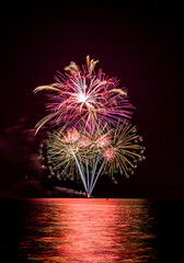 The blurred background of fireworks (light trails) is beautiful at night, seen in the New Year holidays, Christmas events, for tourists to take pictures during public travel.