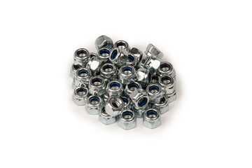 A group of metal nuts isolated on a white background.