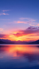 Fototapeta premium Sunset over calm lake with vibrant clouds and reflections.