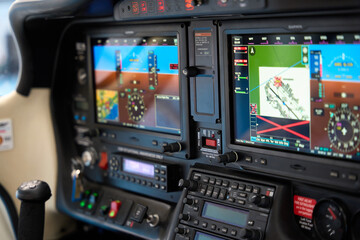 Modern aircraft cockpit control panel with navigation system displaying flight route