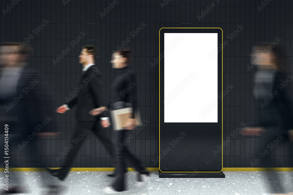 Poster vertical digital advertising screen with blank white display in subway corridor with motion-blurred 