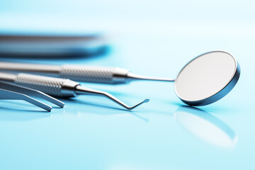 Closeup of stainless steel dental tools on glossy blue surface with soft light and blur background, representing clean medical design concept. 3D Rendering