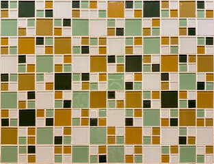 Close up of green, brown, and white mosaic tiles. Mosaic tiles are often used in the bathroom and kitchen finishes. Seamless background texture.