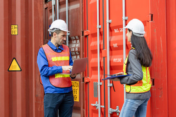Foreman dock workers checking containers box at shipping yard, Logistics workers at shipping port...