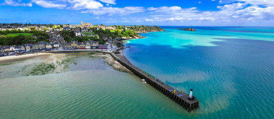 France travel, most scenic traditional villages in Brittany - beautiful Cancale, famous for oysters and turquoise sea. High angle drone panorama of old town and lighthouse
