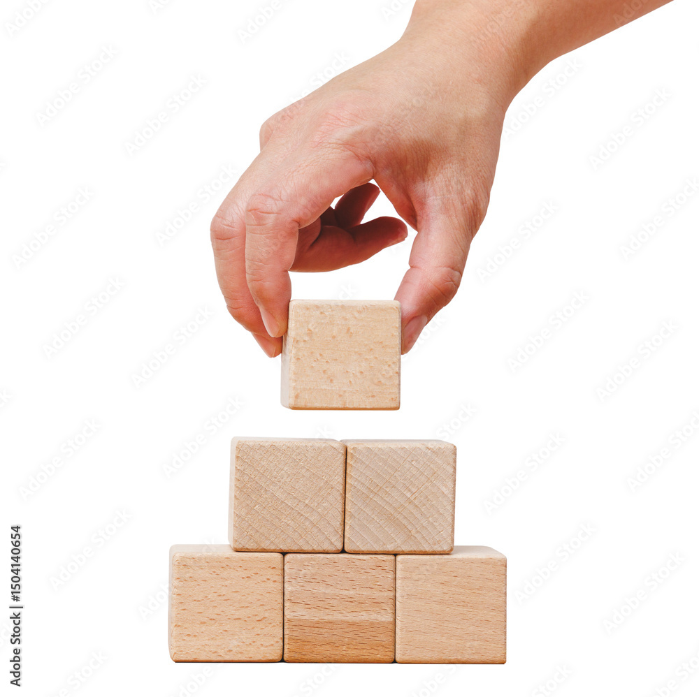 Poster hand holding square blank wooden cube block while stacking into a pile. isolated cutout in transpare