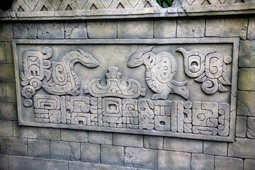 Bas-relief with antique drawings and inscriptions in a rectangle of stone. Medieval architecture, world tourism.