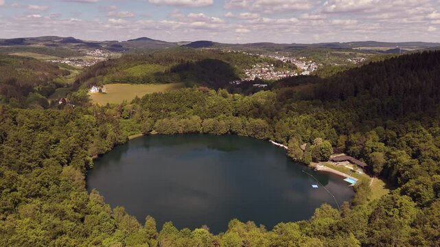 Gem&uuml;ndener Maar Volcanic Lake in the Eifel, Germany &ndash; Aerial View