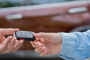 lease, rental car, sell, buy. Dealership manager send car keys to the new owner.  Sales, loan credit financial, rent vehicle, insurance,  renting, Seller, dealer, installment, car care business.