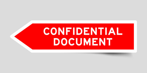 Red color arrow shape sticker label with word confidential document on gray background