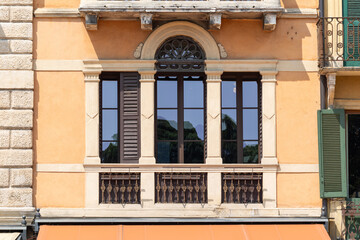 Historic Italian Palazzo Facade with Classical Columns and Ornate Balcony Architecture