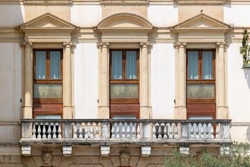Classical European Palace Facade with Ornate Columns, Pediments and Stone Balustrade