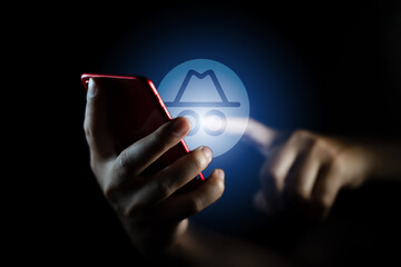 Businessman pressing virtual disguise icon, managing digital privacy and incognito mode, concept of...