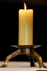 Catholic church. Candle lit on the altar.