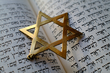 Fototapeta premium Judaism. The Bible in Hebrew with a star of David.
