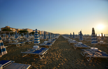 the sun rises at dawn on the beach Still deserted