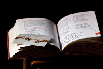 Catholic Church. Mass book with a religious image. Our Father prayer.
