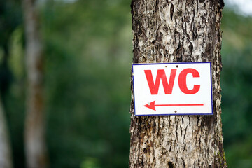 Sign indicating public restrooms WC. Kontum. Vietnam.