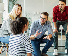 Obraz premium Group of young business people having a meeting or presentation and seminar in the office. Portrait of a young business man