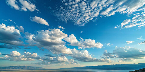 Fototapeta premium Serene Lakeside Scenery with Cumulus Clouds and Blue Sky
