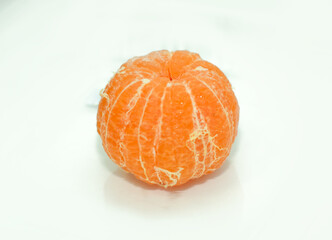 Fresh peeled orange mandarin citrus fruit isolated on white background for healthy eating and nutrition concepts