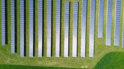 Solar energy panels converting sunlight inti electricity, renewable photovoltaic electricity production sun green energy. Solar energy. Aerial view footage 4k, drone vertical video - Powered by Adobe