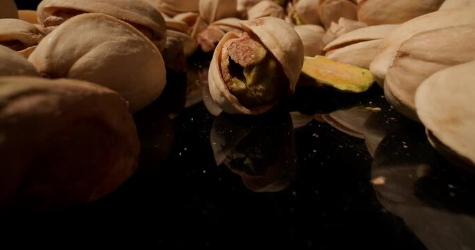 mix of shelled and unshelled pistachios, showcasing earthy tones and crunchy details