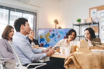 Business asian people working together in an ESG office package by recycle material