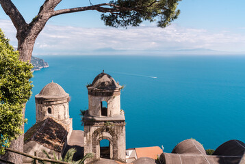 Ravello, Italy - April 27, 2025: Large pine trees in the garden of Villa Rufolo, looking down from the terrace onto the hillside on the Amalfi Coast, in the town of Ravello.