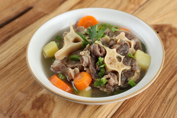 Indonesian Oxtail Soup or Sop Buntut on White Bowl