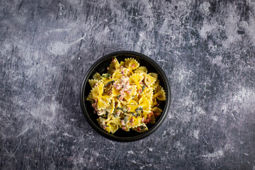 Carbonara pasta. Farfalle with pancetta, egg, parmesan cheese and cream sauce.