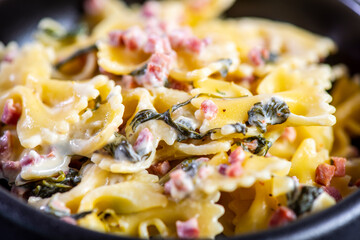 Carbonara pasta. Farfalle with pancetta, egg, parmesan cheese and cream sauce.