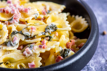 Carbonara pasta. Farfalle with pancetta, egg, parmesan cheese and cream sauce.