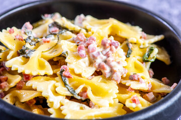 Carbonara pasta. Farfalle with pancetta, egg, parmesan cheese and cream sauce.