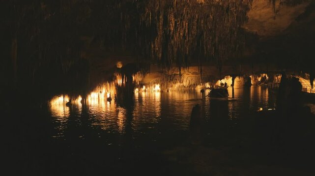 Boats in underwater caves in Mallorca, Spain