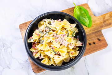 Carbonara pasta. Farfalle with pancetta, egg, parmesan cheese and cream sauce.